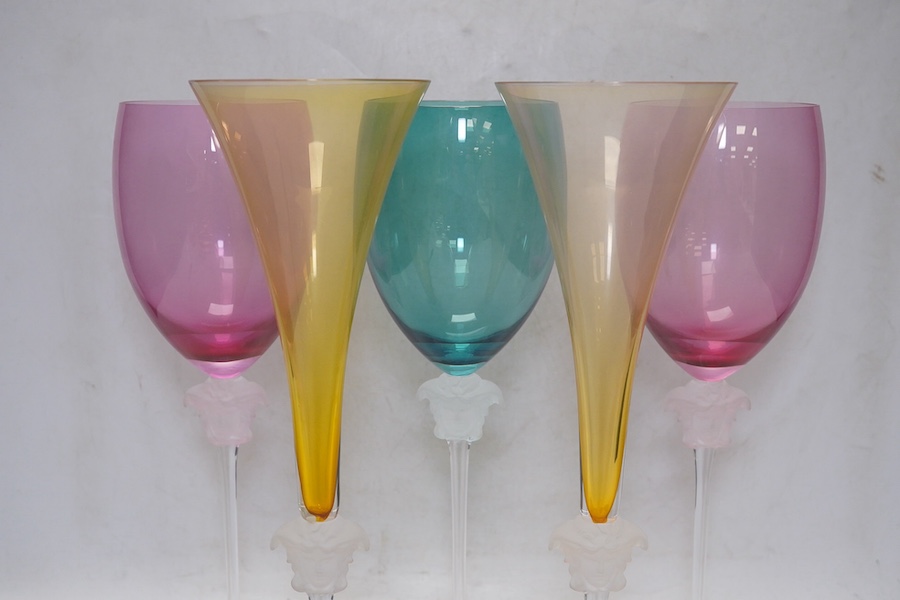 Five boxed Rosenthal for Versace Medusa head glasses; three wine glasses and two champagne flutes in various colours, 30cm high. Condition - good.